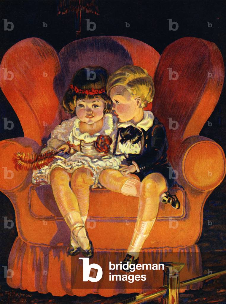 Boy and Girl sitting in armchair 1923.