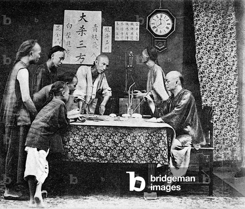 Group of men playing Fan-Tan