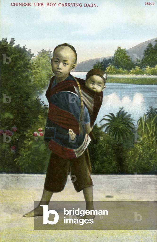 Chinese boy carrying child