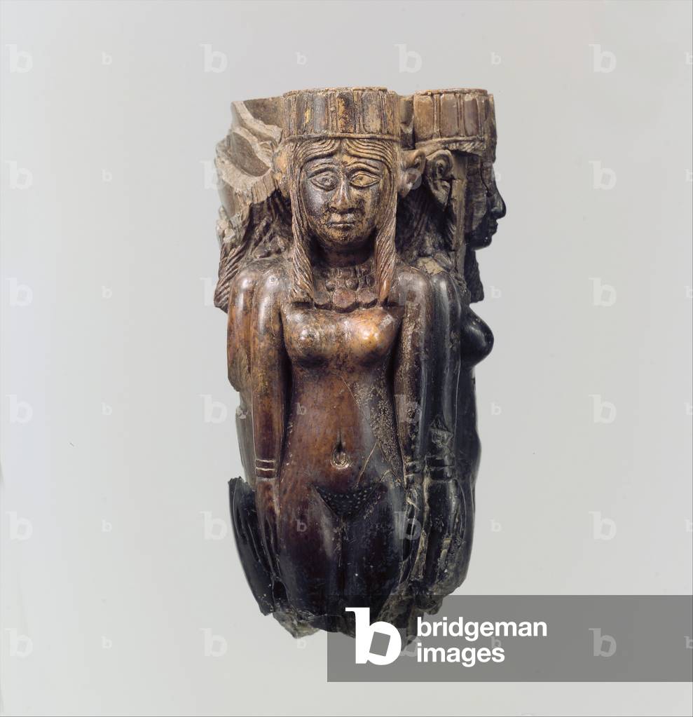 Fan or fly-whisk handle in the form of four female figures, c.8th-7th century B.C. (ivory)