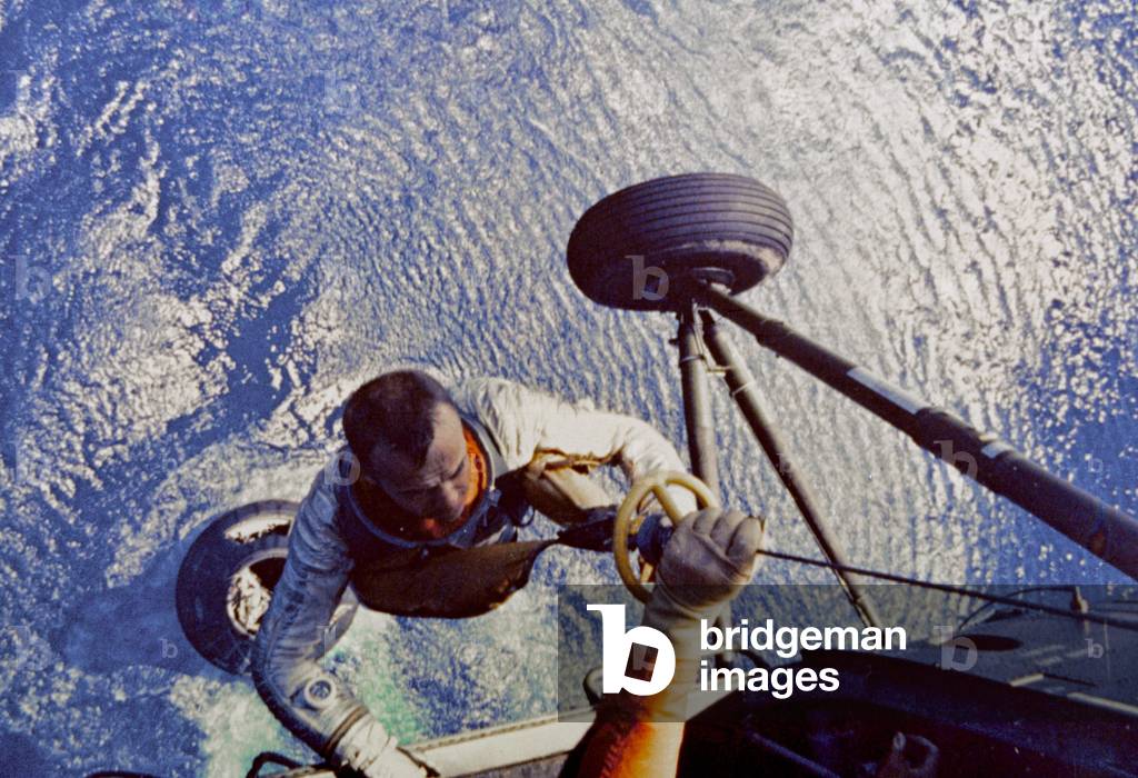 Astronaut Alan B. Shepard is hoisted aboard a U.S. Marine helicopter after splashdown of his Freedom 7 Mercury space capsule on May 5 1961 (photo)