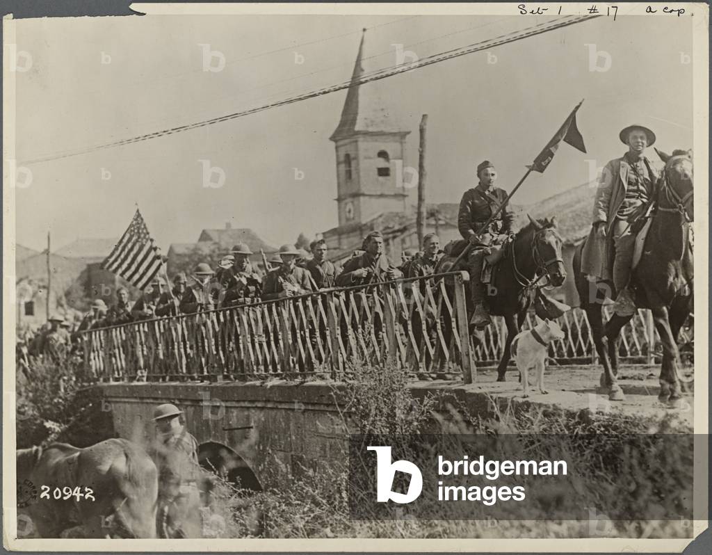 American Engineers returning from the St Mihiel front cross the bridge at Nonsard-Lamarche, 1918 (b/w photo)