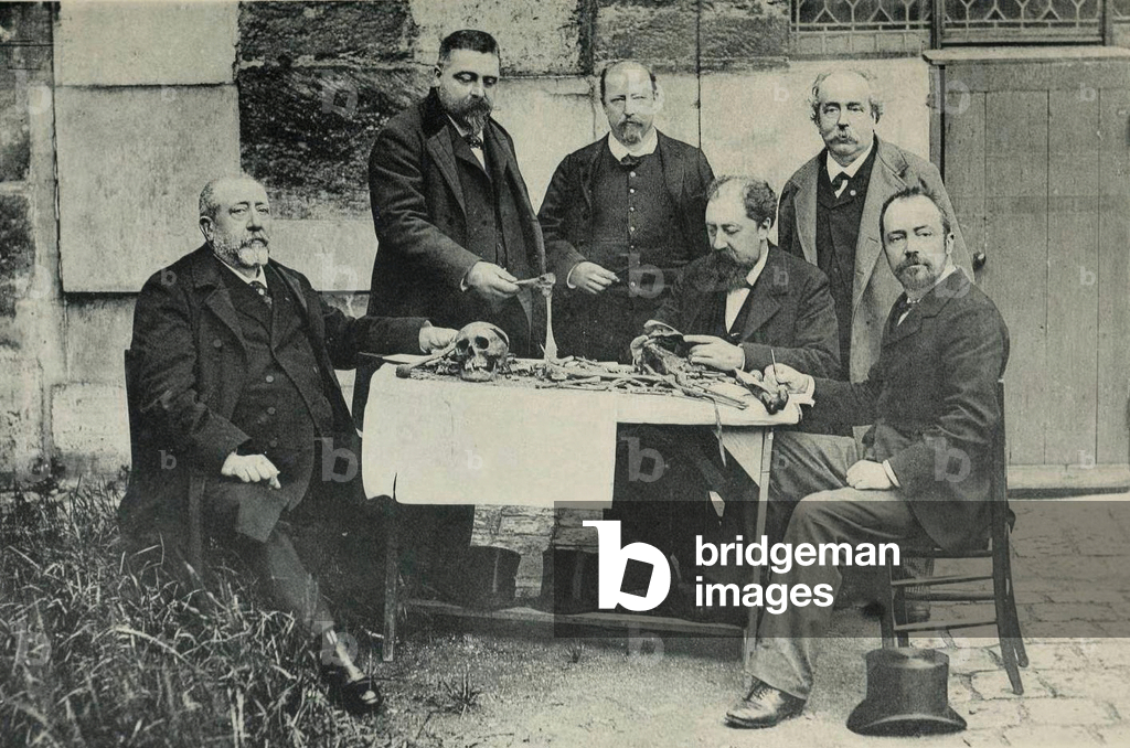 Bones of a young man, exhumed in 1846, wrongly attributed to Louis XVII, left to right, Magitot, de Backer, Quétin, Bilhaut, Talrich, Manouvrier, 1894 (b/w photo)
