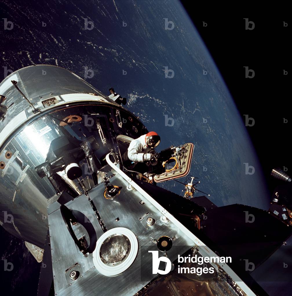 Scott stands in the open hatch of the Apollo 9 Command Module Gumdrop, 1969 (colour photo)