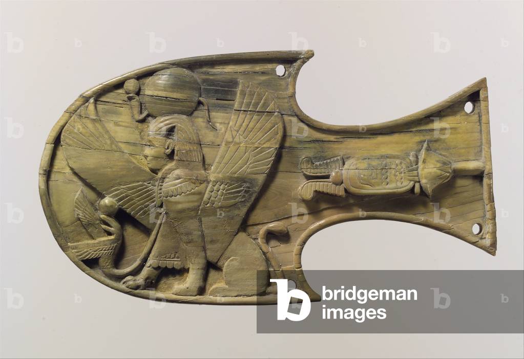 Horse blinker carved in relief with a seated sphinx, c.8th century BC (ivory) 