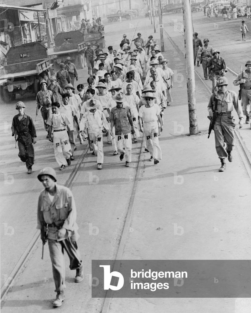 Japanese prisoners of war being guarded by Americans, 1945 (b/w photo)