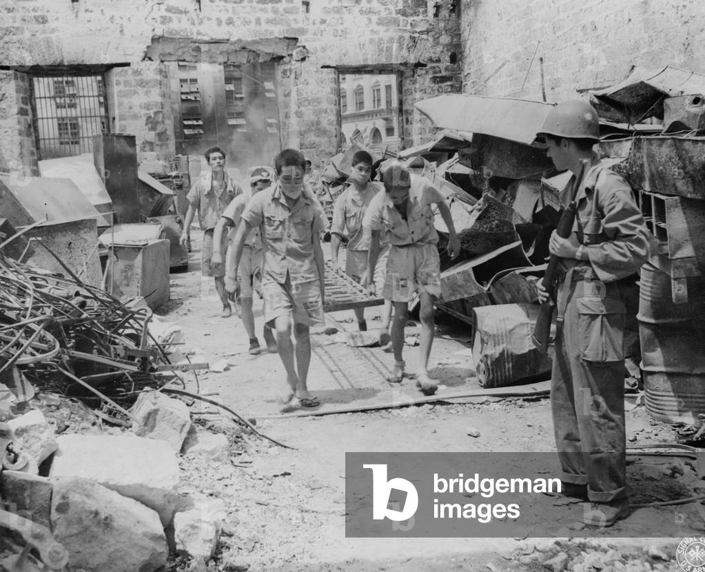 Japanese prisoners of war being guarded by Americans, 1945 (b/w photo)