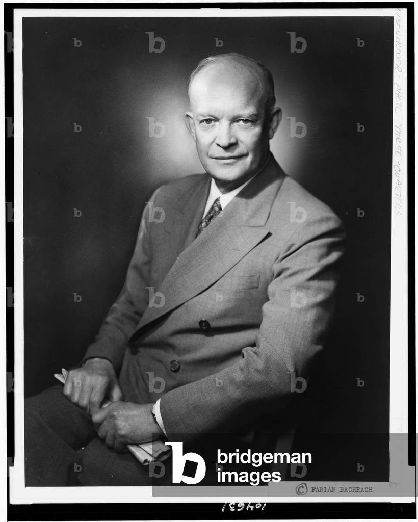 Dwight D. Eisenhower, three-quarter length portrait, seated, facing front, c.1952 (b/w photo)