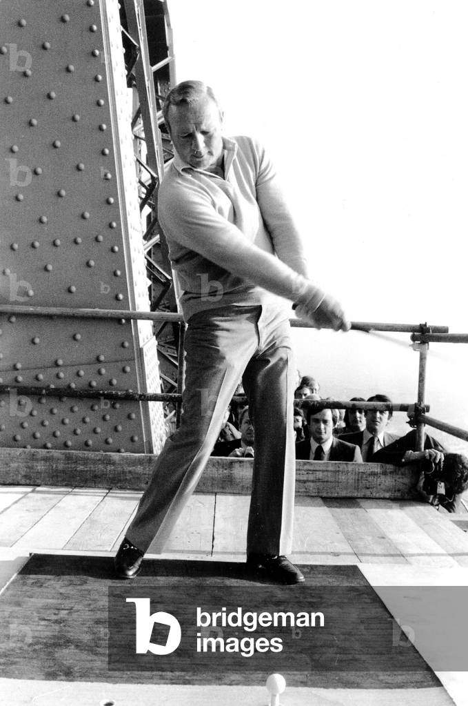 American Golfer Arnold Palmer Throwing The Ball From 2Nd Floor of Eiffel Tower For Opening of 8Th Lancome Golf Trophy October 13, 1977 (b/w photo)