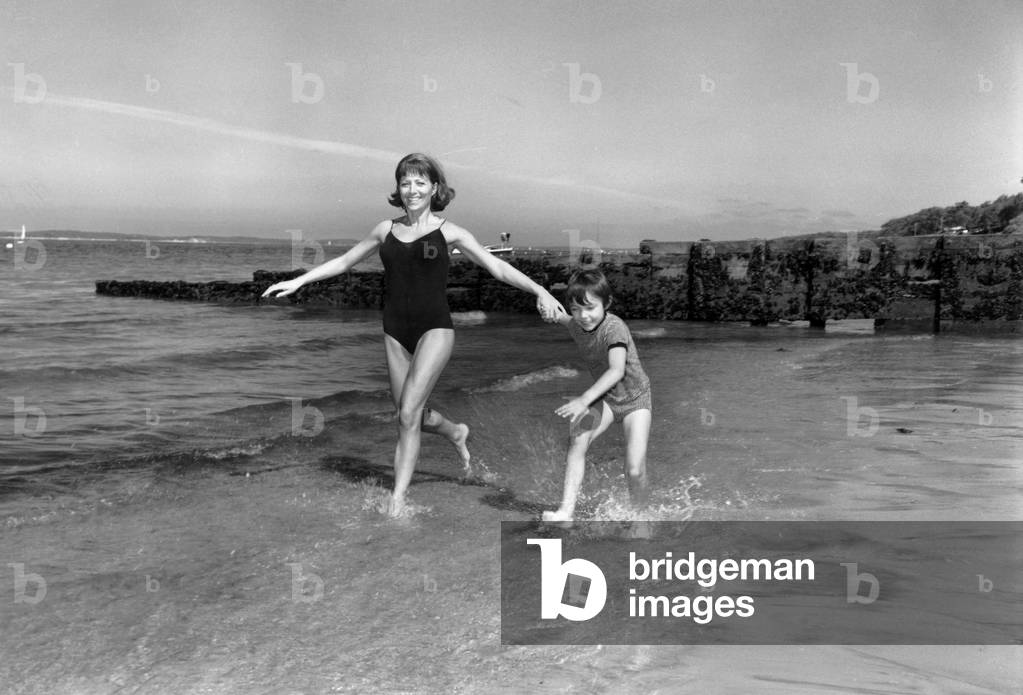 French Actress Stephane Audran and her Son Thomas on Pilat Beach (South of France) on September 8, 1970 (b/w photo)