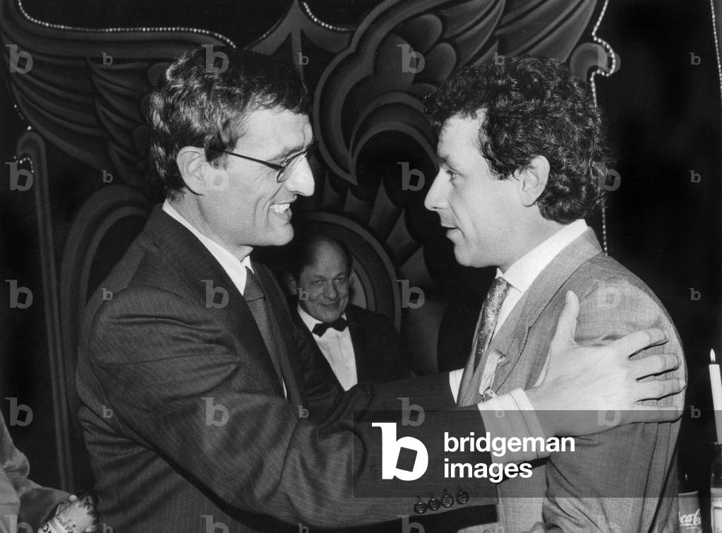 French Minister of Culture Francois Leotard Decorating Actor Francis Perrin With The French Award For Distinguished Services in A Public Or Private Capacity, January 1987 (b/w photo)
