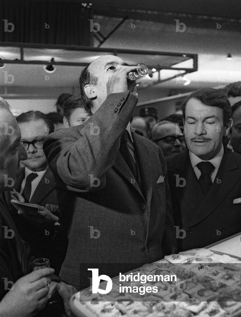 Opening of the Foire de Paris, April 29, 1972 : French minister of economy Valery Giscard d'Estaing (VGE) drinking vodka at the stand of Poland (b/w photo)