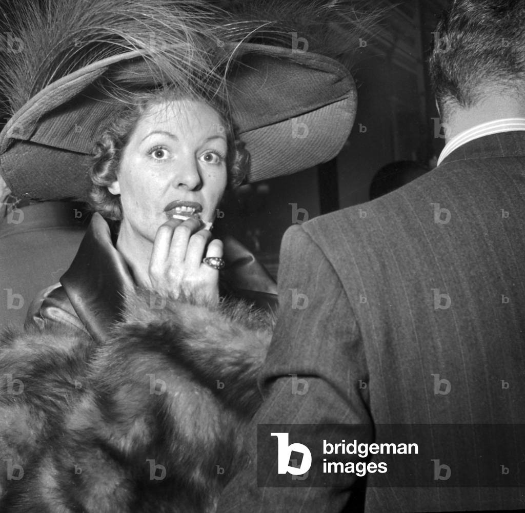 French Actress Madeleine Robinson (Rolling A Cigarette) at Cocktail Given For Film 