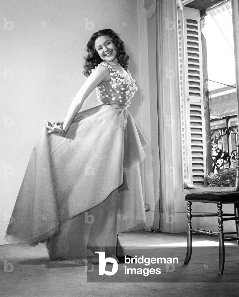 French actress Maria Riquelme wearing a dress by Guy Douvier with shellfishes she'll wear for premiere of film 