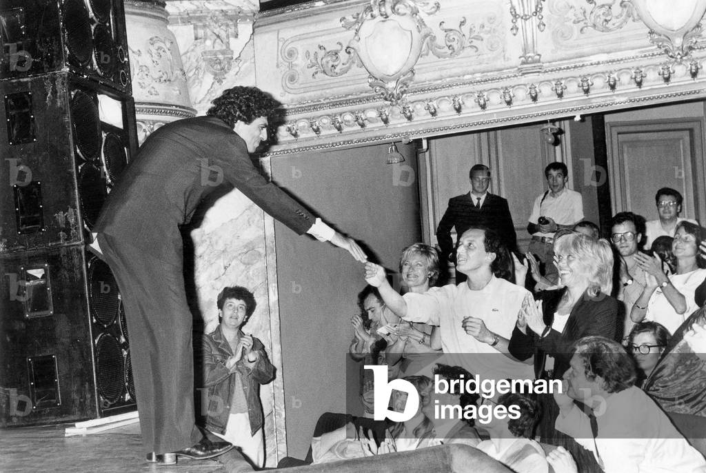 French Singer Enrico Macias Shaking Hands With Singer Didier Barbelivien during Homage Show To Georgesbrassens in Sete (South of France) June 24, 1986 (b/w photo)