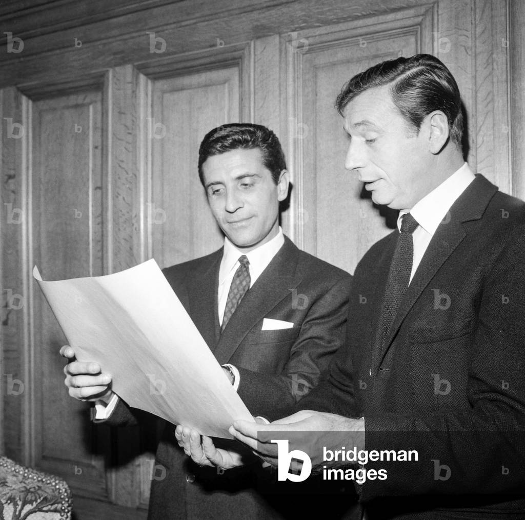 Yves Montand congratulating Gilbert Becaud who has just received a prize (