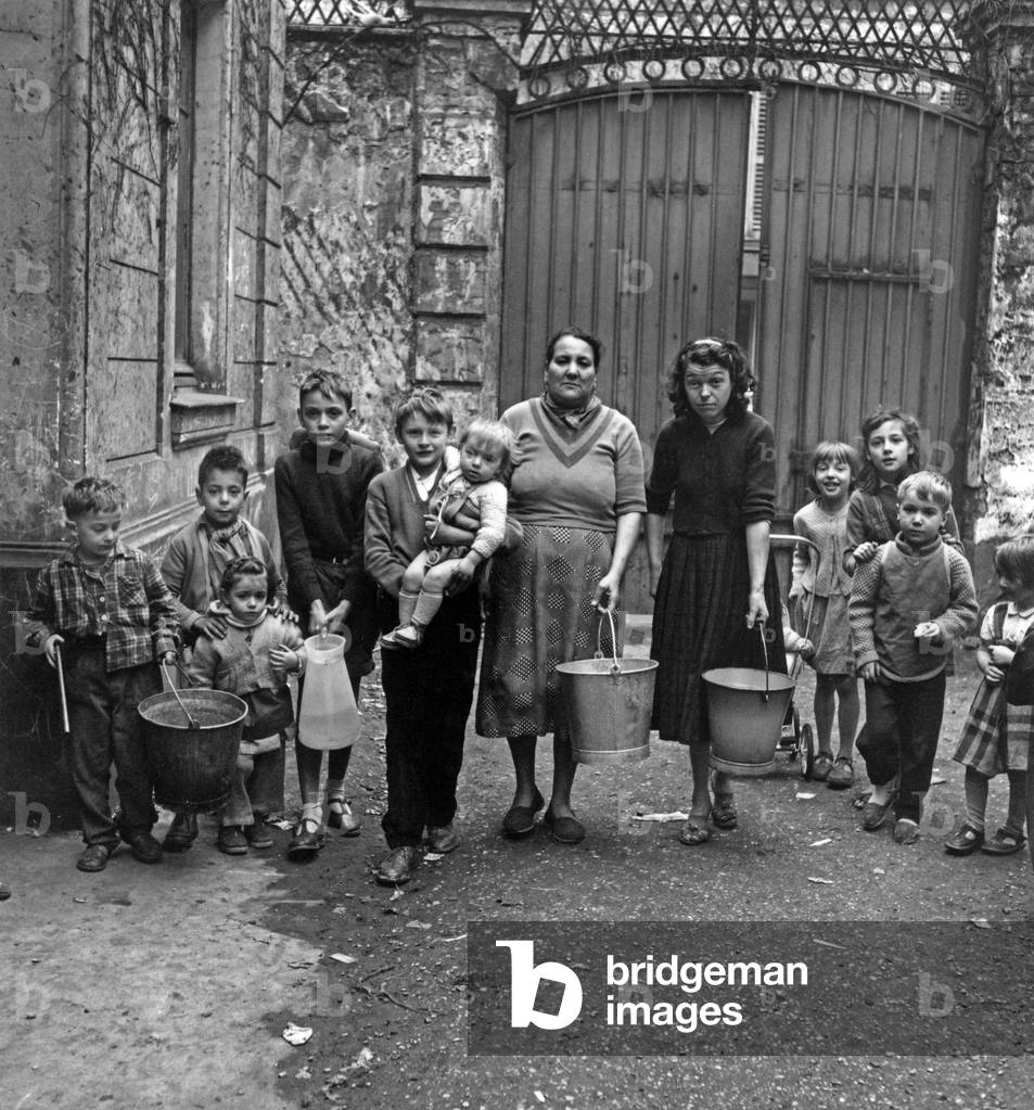An Humble Family With More Than Two Children in Rodier Street in Paris on January 10, 1957 (b/w photo)