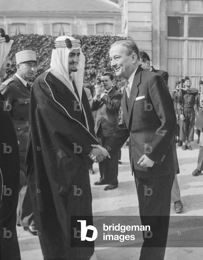 French Minister of Defense Georges Bidault giving Legion of Honour to Prince Mecheed, Saudi Minister of Defense, Paris, October 16, 1951 (b/w photo)