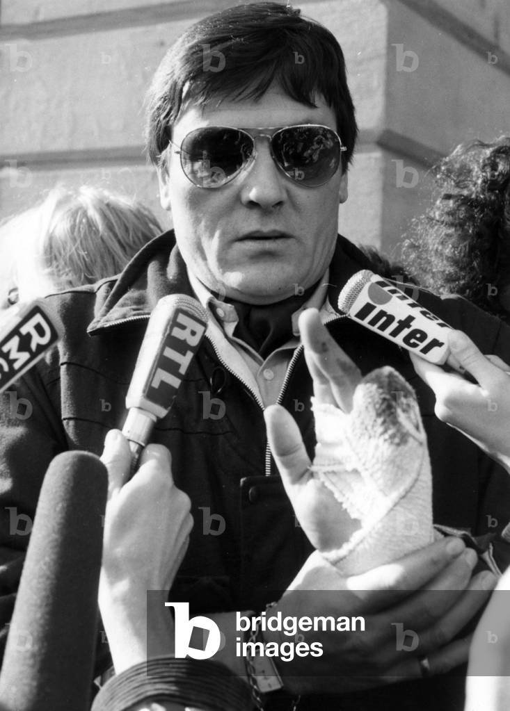 Roland Agret Making A Statement To The Press in Front of The Minister of Justice in Paris: He Has A Dressing on his Left Hand For He Cut Himself Two Phalanxes To Obtain The Review of his Trial February 21, 1984 (b/w photo)
