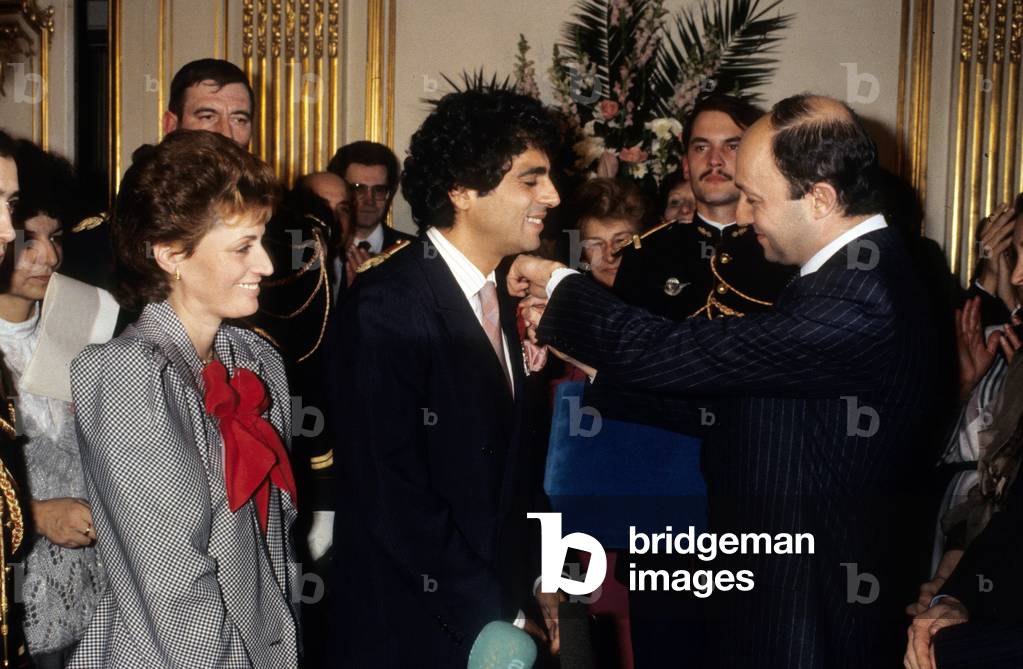 Enrico Macias Receiving Legion of Honour From French Minister Laurent Fabius on February 1St, 1985 in Presence of his Wife Susie Macias (photo)