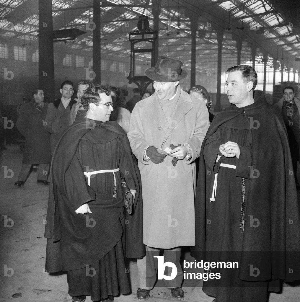 Director Roberto Rossellini arriving in Paris to attend screening of his film 