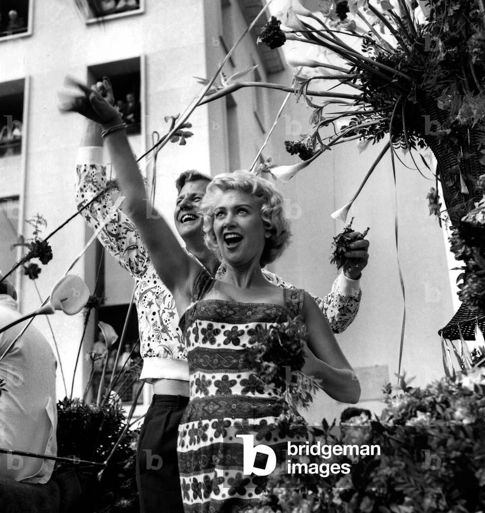 Actors Martine Carol and Tony Wright during Flowers Battle at Cannes Film Festival May 4, 1956 (b/w photo)