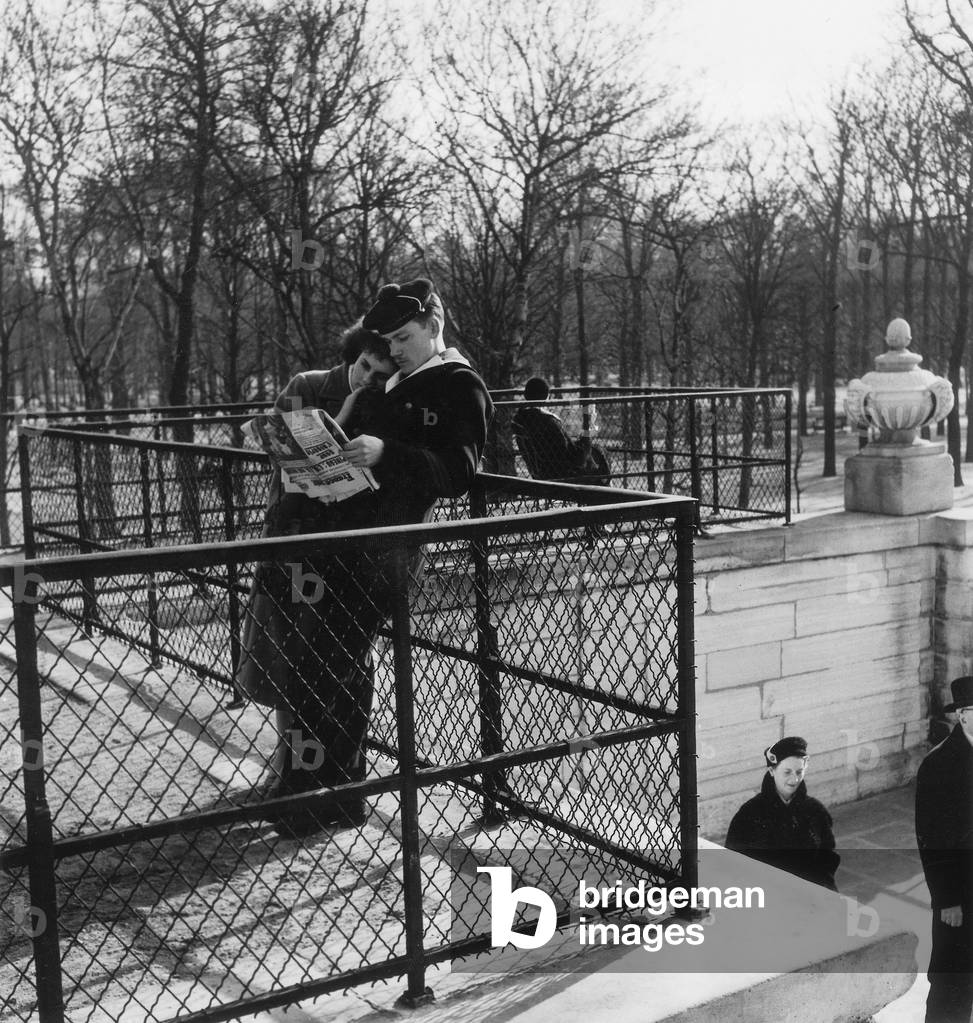 Couple of Lovers Reading Paper in A Garden February 4, 1957 (b/w photo)