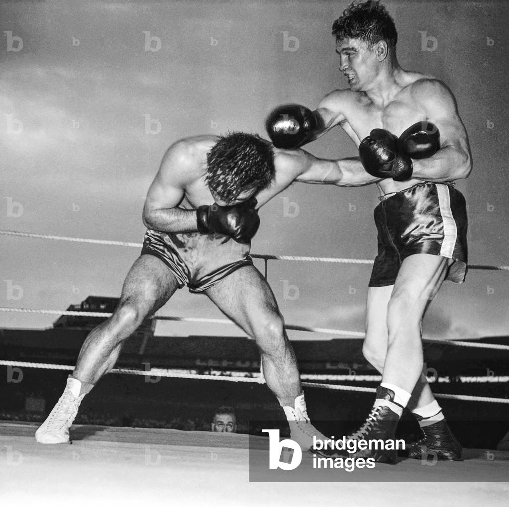 Boxing match between Laurent Dauthuille and Robert Villemain, June 9, 1951 in Montrouge, France (b/w photo)