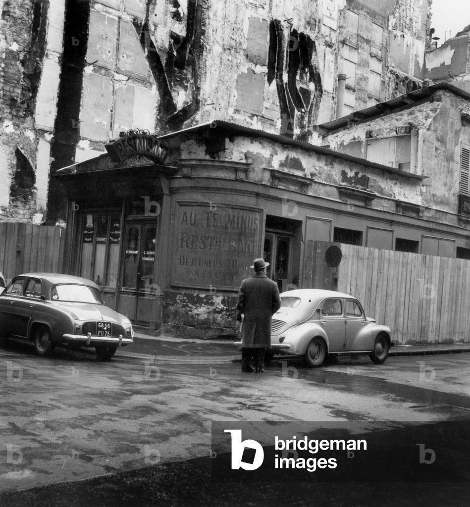 Alone In The Ruins Of Old Buildings Expropries At The Corner Of The Streets Of Lille And De Poitiers A Parisian Bistro “Terminus” Condemns To Leave Place To A Building On April 10, 1958 (b/w photo)