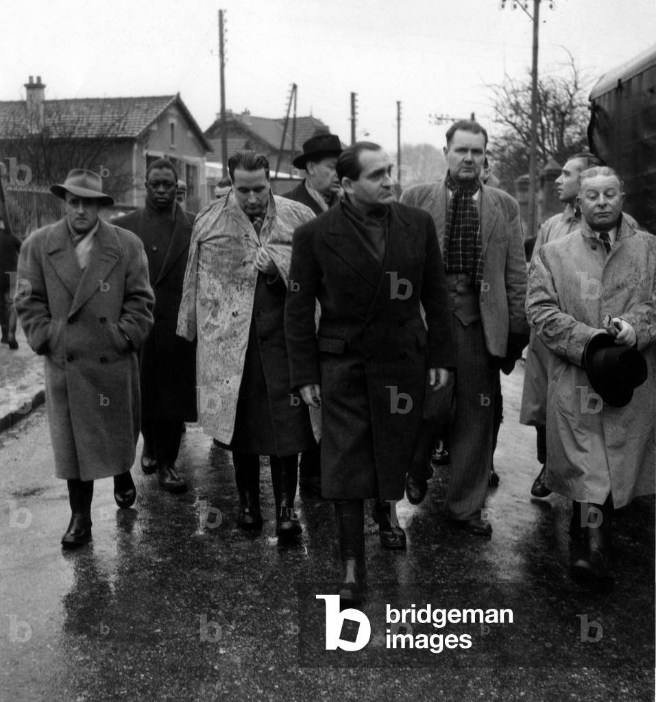 Francois Mitterrand, French Minister of Interior, and Pierre Mendes France, French Prime Minister, Visiting Villeneuve Saint Georges After Floods in France on January 21, 1955 (b/w photo)