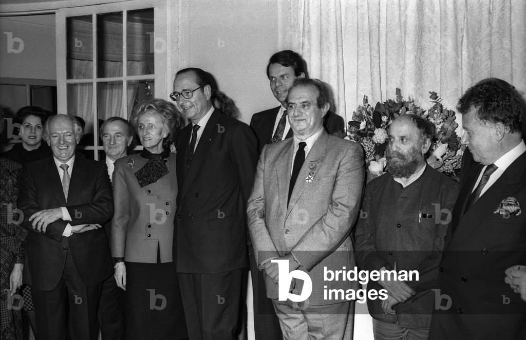 French cook Paul Bocuse has received the Legion of Honour, Pre catelan, Paris, February 11, 1987 : l-r :Gaston Lenotre, Bernadette and Jacques Chirac, Michel Noir, Paul Bocuse, sculptor Cesar (Cesar Baldaccini) and Philippe Bouvard (b/w photo)