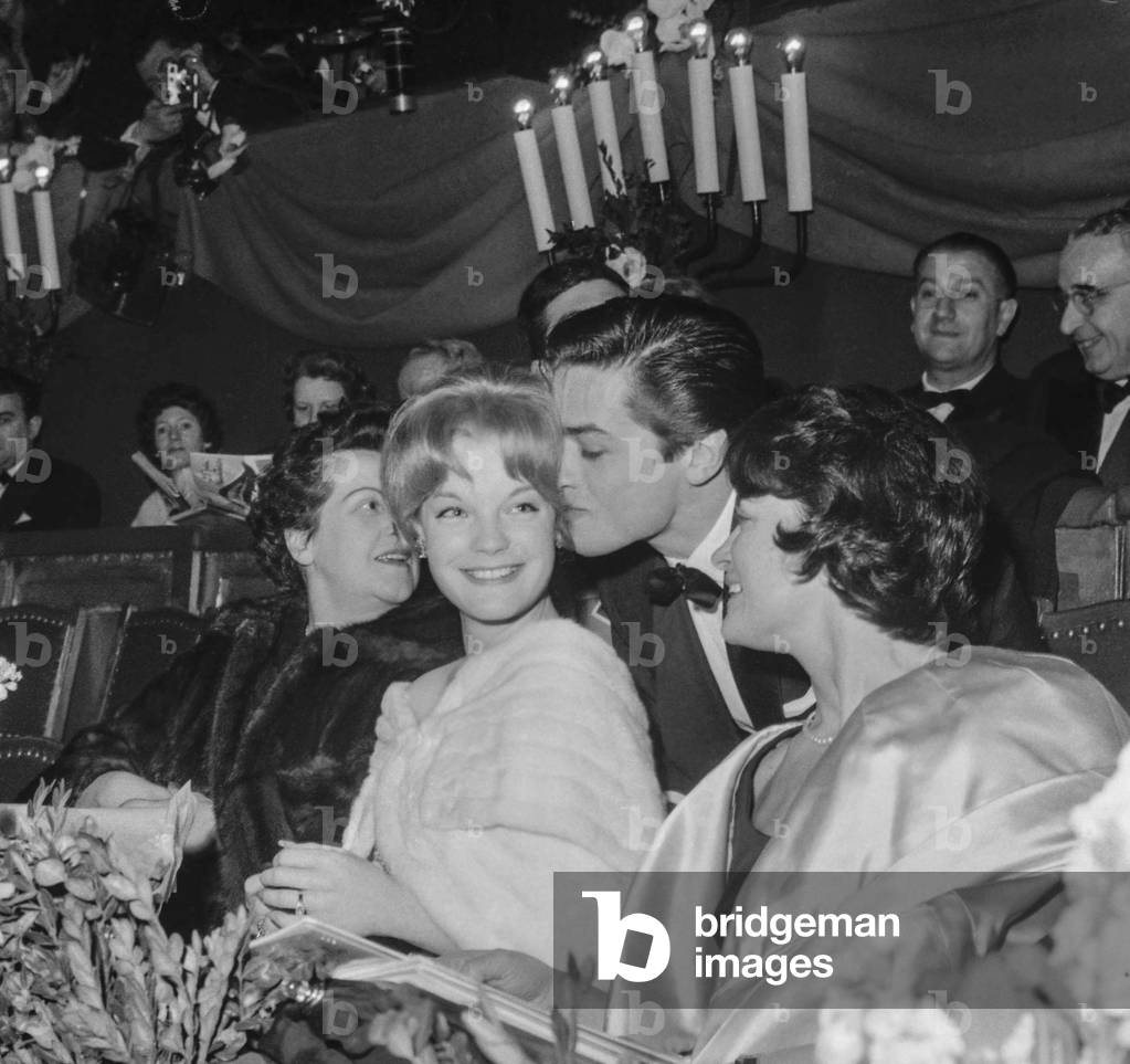 Gala of Artists, Paris, March 7, 1959 : Alain Delon kissing Romy Schneider under look of Olga Horstig and �dith Arnold (Alain Delon's mother) (b/w photo)