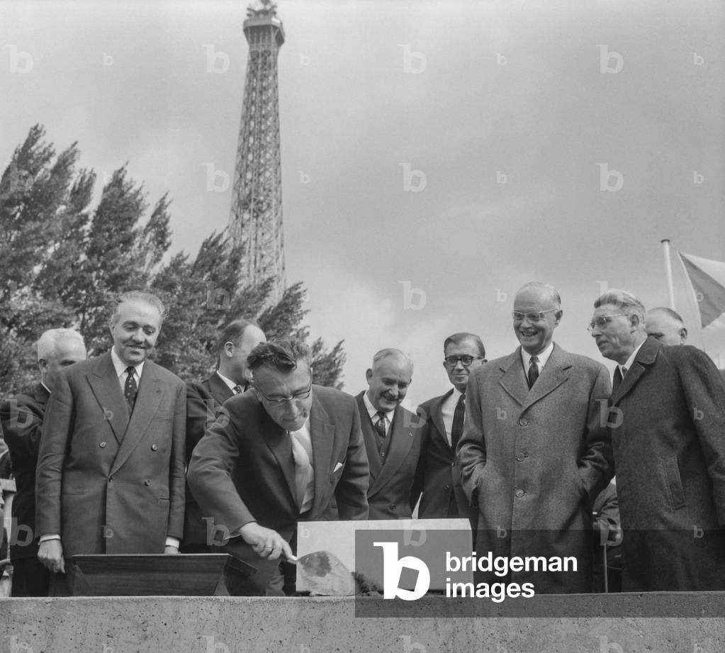 Pr Oeftering, director of the International Union of Railways, laying the  the cornerstone of the new building of the  International Union of Railways in Paris on September 20, 1960 under look of Mr Segalat, Dargeou and Antonini (b/w photo)
