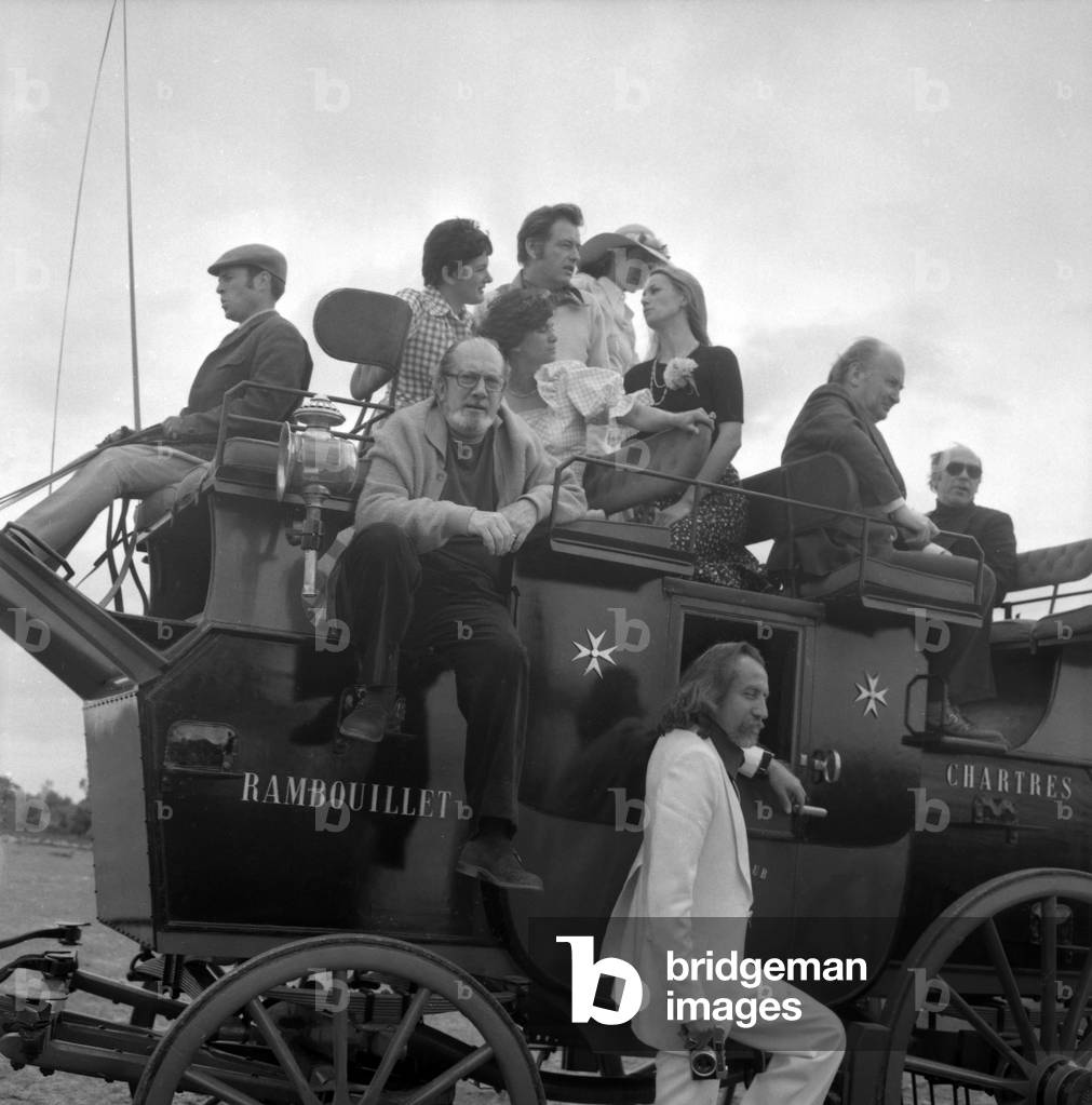 Souvigny mail coach, France, June 10, 1974 : Frederique Hebrard, her husband Louis Velle, Claudine Auger and Raymond Oliver (b/w photo)