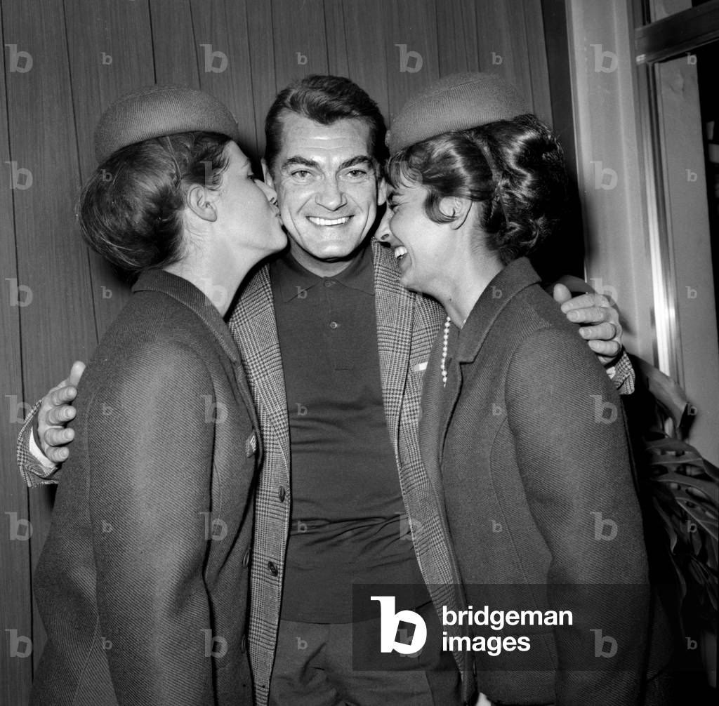 2 Hostesses With Jean Marais at Bourget Airport in Paris, October 23, 1964 (b/w photo)