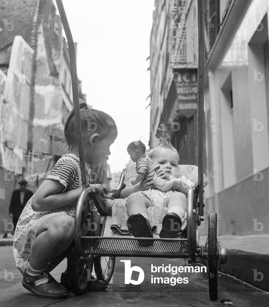 Girl keeping her little brother