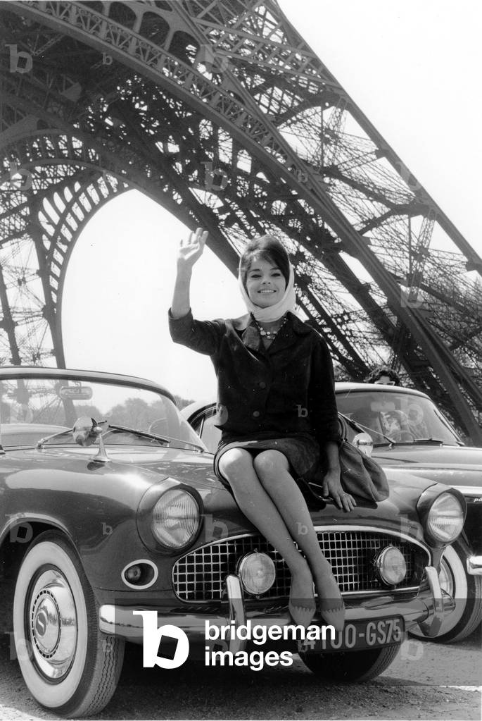French Actress Pascale Petit Selling her Car at Eiffel Tower, Paris, May 11, 1959 (b/w photo)