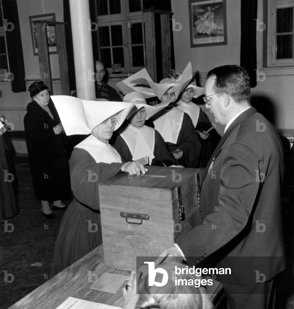 Religious Voting During the Referendum January 8, 1961. (b/w photo)