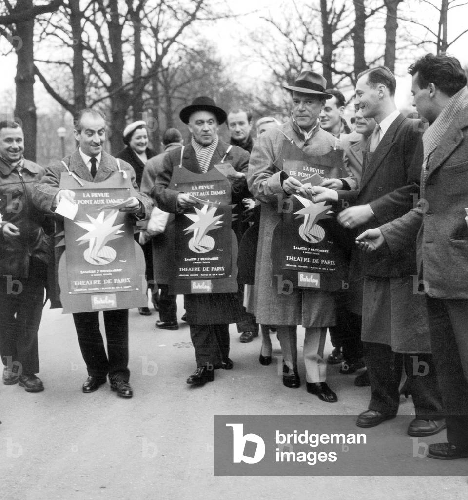 Actors Louis De Funes, Jean Marsac, Eddy Constantine Distributing Leaflets For Show in Paris November 20, 1957 (b/w photo)