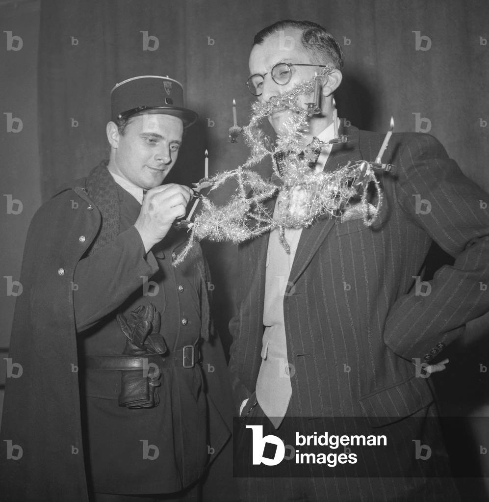 The Ball of the Bearded Men, organized by the National Federation of Draftsmen, at the Moulin de la Galette, Paris, December 3, 1949 (b/w photo)