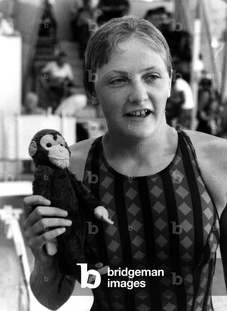 The French Champion Du 200 Metre Quatre Nages Feminin Caroline Carpentier at Stade Georges Valleray de Paris Wins The Feminin Title Or She Shows Here Her Little Fetiche A Monkey On August 1st 1974 (b/w photo)