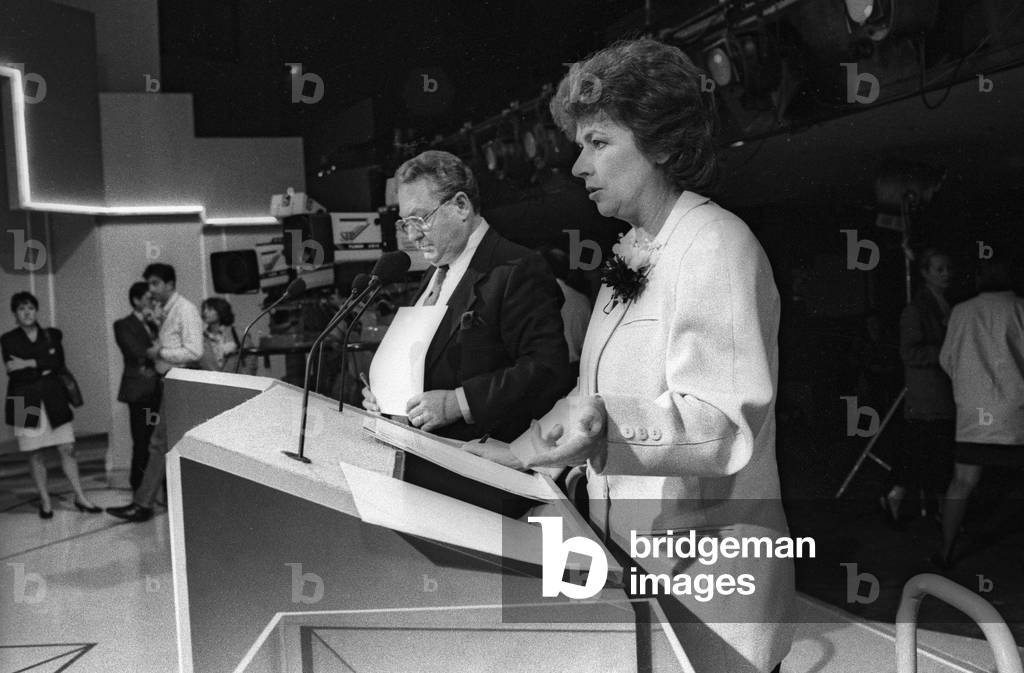 French journalists Gerard Carreyrou and Michele Cotta at time of a debate between candidates at the european election (TF1), Paris, June 9, 1989 (b/w photo)