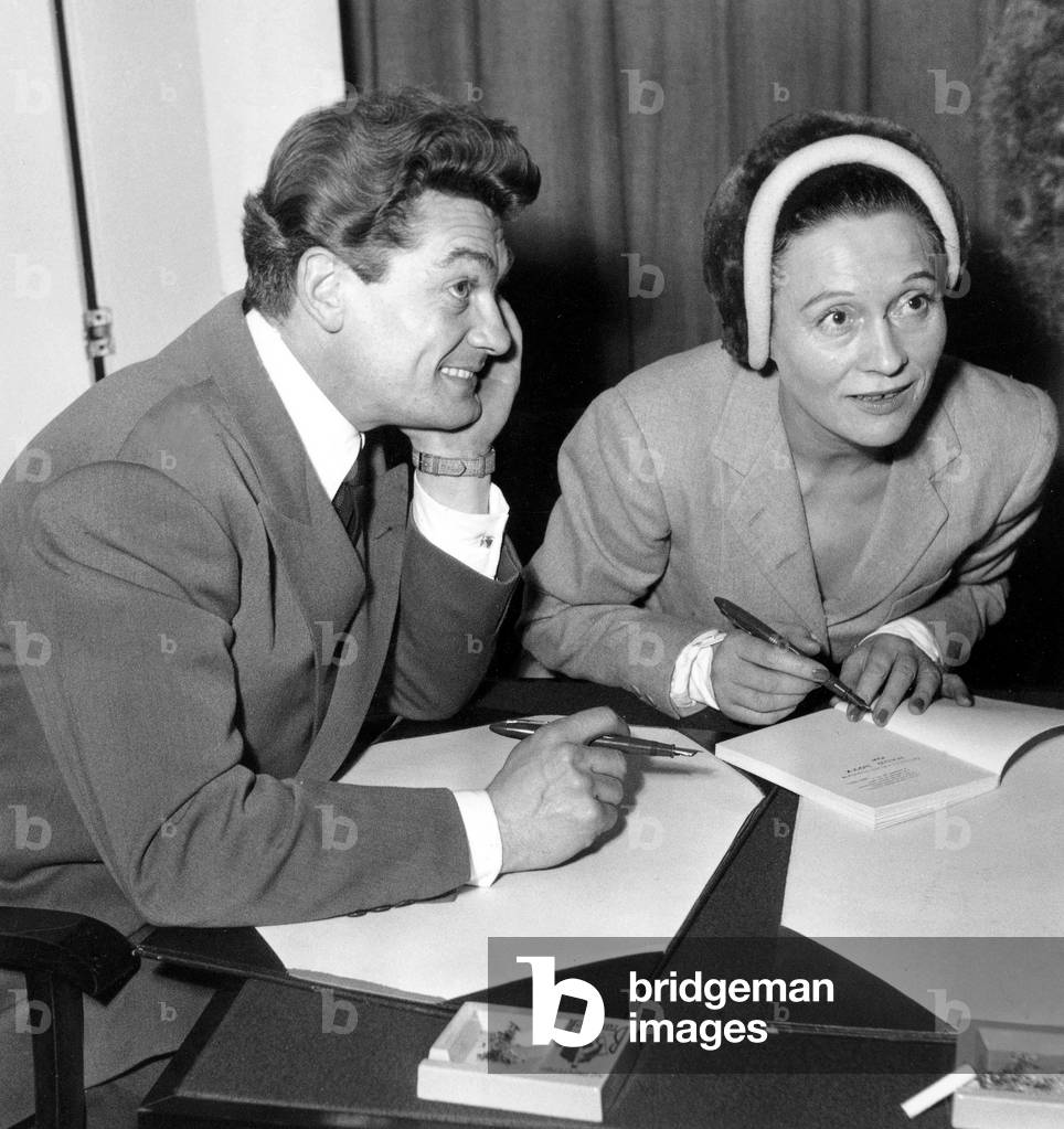Jean Marais and Arletty Signing Autographs in Paris December 31, 1949 (b/w photo)