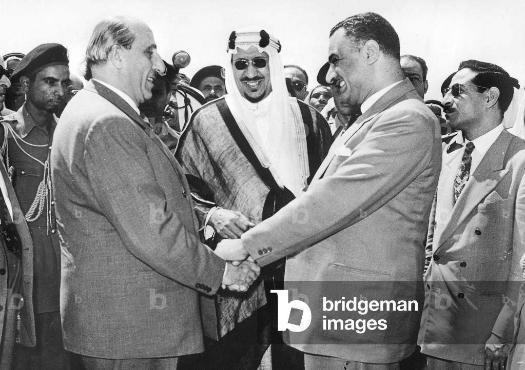 March 8, 1956 Egyptian President Gamal Abdel Nasser (R) Shaking Hands With Syrian Choukry El Kouatly (L) Under Look of Saoud Ibn Abd Al-Aziz King of Saudi Arabia (b/w photo)