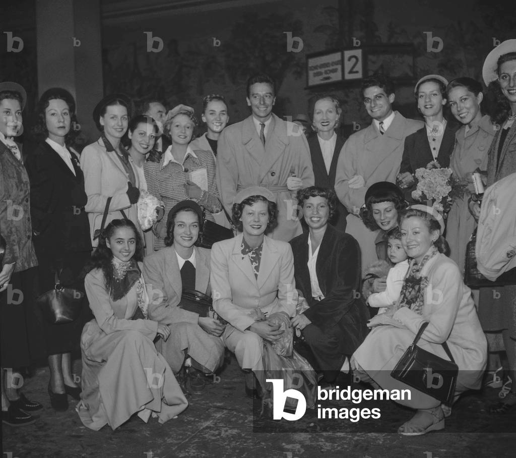 The corps de ballet of the Paris Opera leaving for Geneva, September 1949. Here at the Invalides station in Paris : Max Bozzoni, Lycette Darsonval, Michel Renaud, Micheline Bardin (b/w photo)