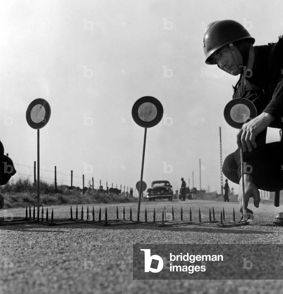Fight Against Road Insecurity : Roadblocks Can Be Used on French Roads : Caltrop Barrier Blocks Automatically The Drivar If He Doesn'T Respect The Controllers, September 12, 1958 (b/w photo)