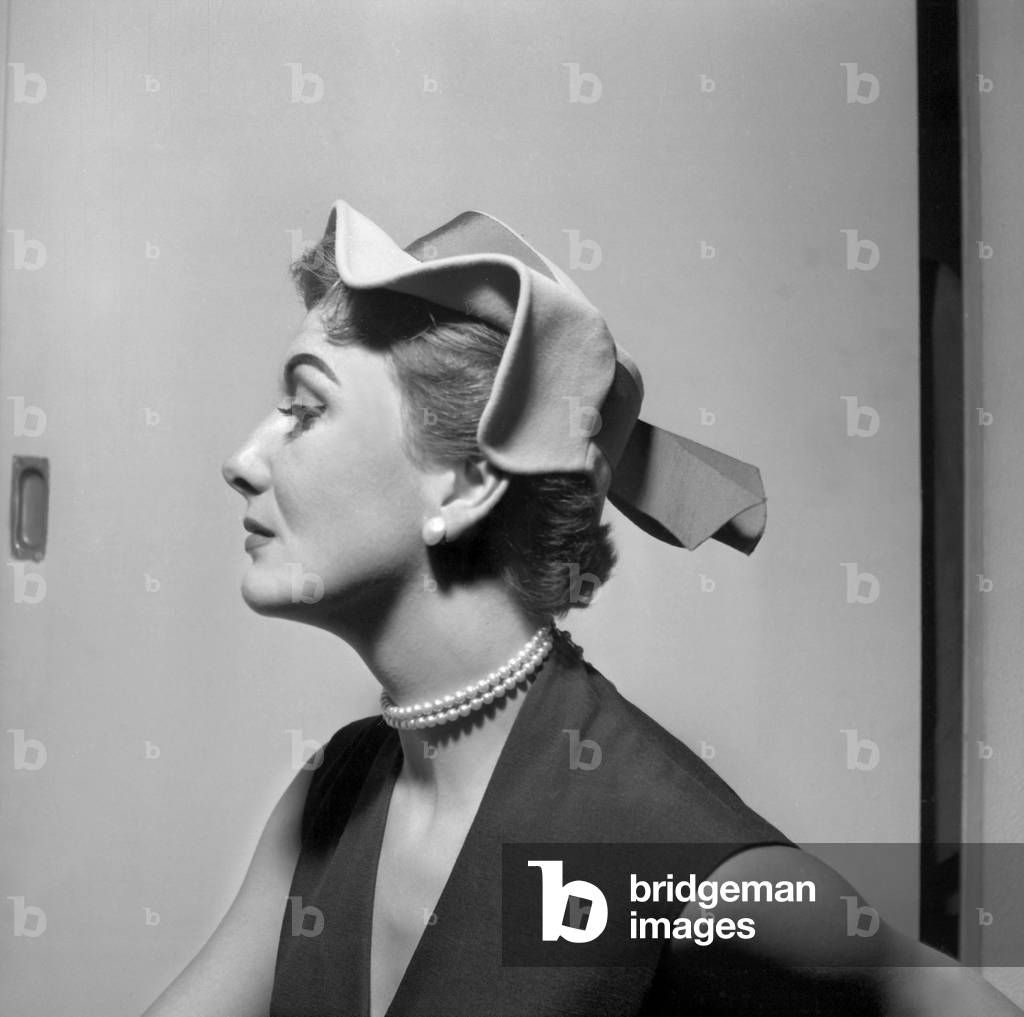 Model Doudette Presenting A Hat By Rose Valois July 1952 (b/w photo)