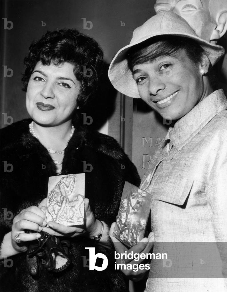 Lyne Dourian and Maria D'Apparecida received their Golden Orphees from the National Academy of Lyric Disc at La Rotonde Du Glacier At L'Opera on April 27, 1967. (b/w photo)
