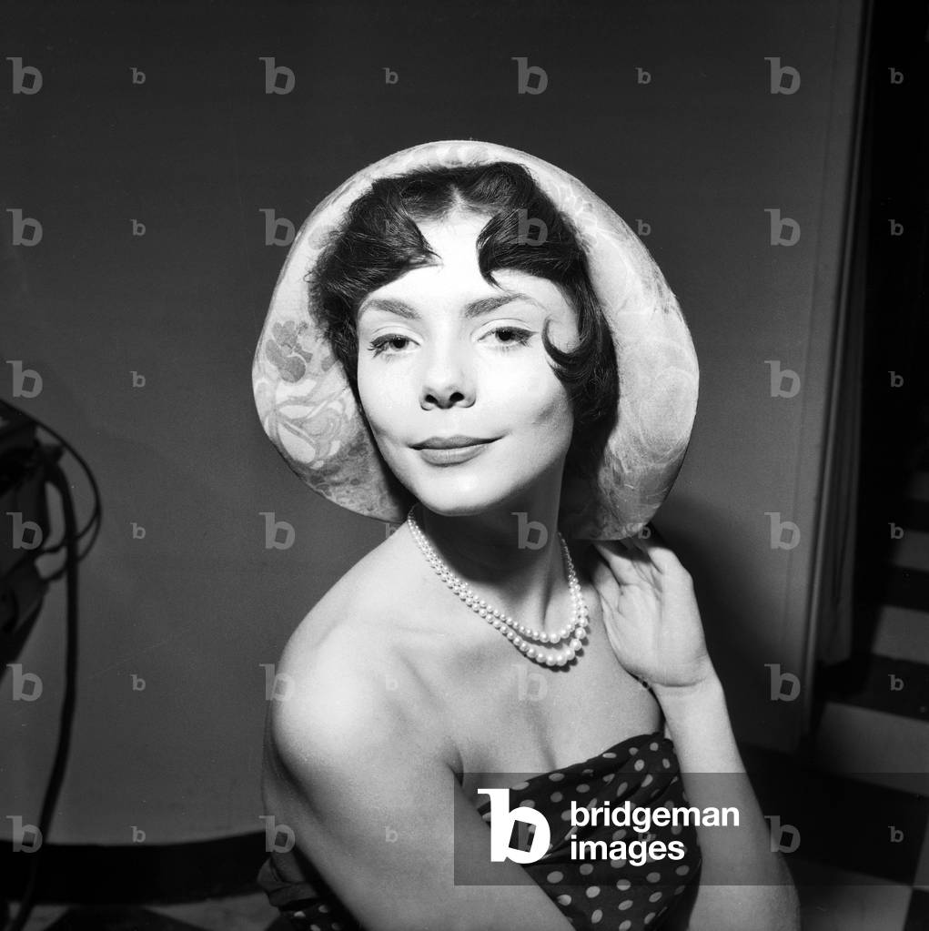 Presentation of Hairstyles and Hats in Paris on February 10, 1961 : Model Marie-Christine With Hairstyle By Roger Pasquier (b/w photo)