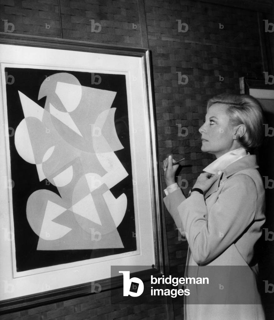 The Actress Michele Morgan at The Dinavierny Exhibition in Front of her Picture, December 4, 1968 (b/w photo)